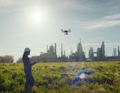 Photo of a Woman Holding a Drone